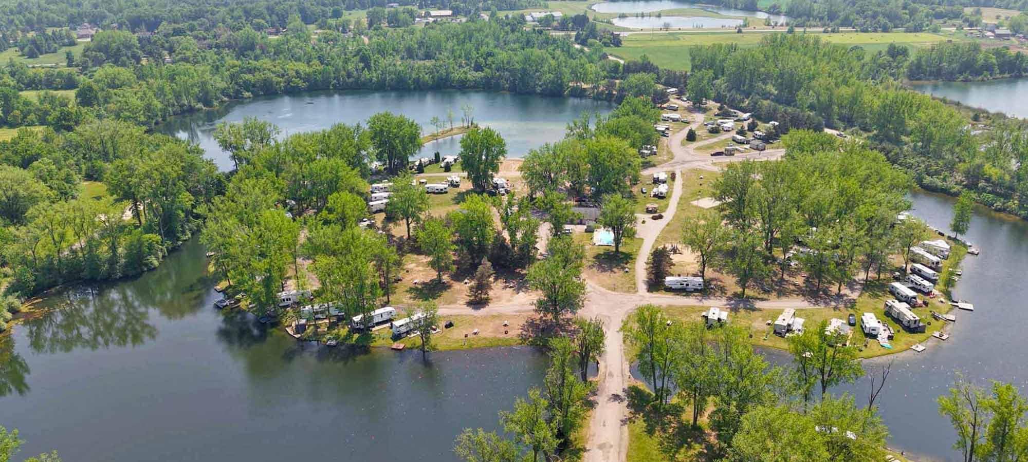 Aerial view of Krystal Lake Family Campground between its private lakes